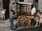 Buy Children Gather by a Vendor Selling "Snowball" Treats at AllPosters.com