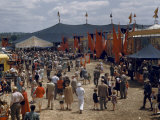 Buy People Wander Up and Down Past Side Shows on a Circus Midway at AllPosters.com