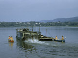 Buy Canoeists Hitch a Ride from Paddlewheel Ferry by Holding on to Stern at AllPosters.com