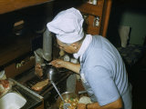 Buy Man Wearing a Chef's Hat Grills Steaks in a Sailboat's Tiny Galley at AllPosters.com