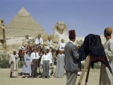 Buy Tourists and Guides Pose for a Photographer Near the Great Sphinx at AllPosters.com