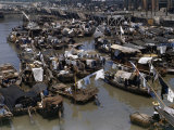 Buy Drying Laundry Hangs from Poles on Houseboats Clustered in a Canal at AllPosters.com