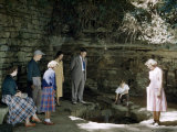 Buy Tourists Peer into Sinking Spring in a Limestone Recess at AllPosters.com