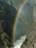 Buy Sunlight Refracted by a Waterfall's Spray Forms a Rainbow in Canyon at AllPosters.com