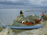 Buy Men Rest Beside Canoes Beached on a Lake's Sandy Shore at AllPosters.com