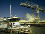 Buy Crane Unloads Sulphur from Barge Delivered by Tugboat at AllPosters.com