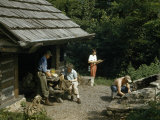 Buy Hikers Prepare a Fire to Cook Dinner at a Hut at AllPosters.com