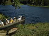 Buy Friends Take Visiting Archeologists on Cruise in Dugout Canoe at AllPosters.com