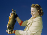 Buy Student Holds a Male Golden Trout at AllPosters.com