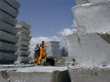 Buy Workers Move Thousand-Pound Pigs of Aluminum with a Forklift Truck at AllPosters.com