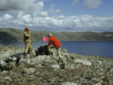 Buy Scientists Use a Manmade Rock Cairn to Measure a Crater Lake at AllPosters.com