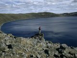 Buy Scientist Overlooks Wind-Ruffled Water of a Crater Lake at AllPosters.com