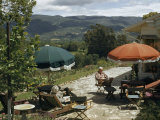Buy Retired Couple Relax on a Patio Overlooking a Valley at AllPosters.com