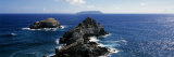 Buy Rock Formations in the Sea with an Island in the Background, Desirade Island, Pointe Des Chateaux, at AllPosters.com