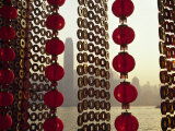 Curtain of Chinese New Year Decorations Frame Victoria Harbour from Tsim Sha Tsui, in Hong Kong