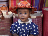 Young Girl Beside a Road-Side Stall Near Antananarivo, Capital of Madagascar