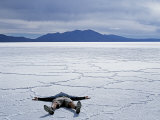 Tourist on Salt Crust of Salar De Uyuni, Emphasising Scale of Largest Salt Flat in World, Bolivia