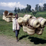Buy Man Carries Traditional Split-Bamboo Baskets to Sell at Kisoro Market, Southwest Uganda at AllPosters.com