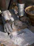 Nyagatom Woman Grinds Sorghum Using Two Stones, Omo River, South-Western Ethiopia