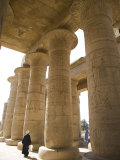 Man Walks Underneath the Giant Columns of the Hypostyle Hall in the Ramesseum, Luxor