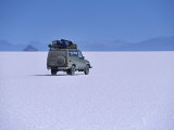Vehicle Drives across the Crusted Salt of the Salar De Uyuni, the Largest Salt Flat in the World