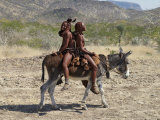 Two Happy Himba Girls Ride a Donkey to Market, Namibia