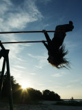 Girl Playing High on Swings at Sunset on Vosu Beach, Located in Lahemaa National Park