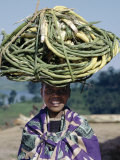 Young Girl Carries Coils of Green 'Rope' to Market Balanced on Her Head