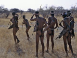Buy Bushmen or San Hunter-Gatherers Pause to Check a Distant Wild Animal in the Early Morning, Namibia at AllPosters.com