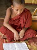 Buy Burma, Lake Inle, A Young Novice Monk Learning at a Monastery School on Lake Inle, Myanmar at AllPosters.com