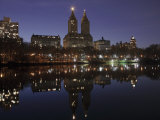 The San Remo Towers Skyline at Night Reflected in the Lake, Central Park, New York City
