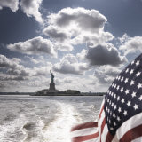 View of Statue of Liberty from Rear of Bot with Stars and Stripes Flag, New York