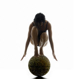 Woman Balancing on Globe