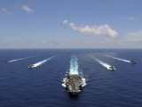 The Aircraft Carrier USS Abraham Lincoln Leading a Formation of Ships