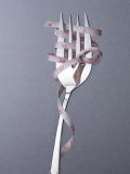 Fork with Measuring Tape Wrapped around It