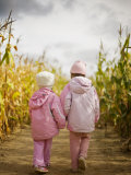 Buy Two Children in Pink, Walking Through Cornfield at AllPosters.com