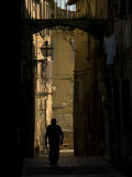 Man Walks Down a Narrow Street in Florence