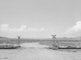 Black and White Image of a Train Cross