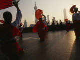 Women Exercise in the Morning by Fan Dancing on the Bund