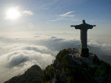 Christ the Redeemer Statue at Sunrise Above the Clouds