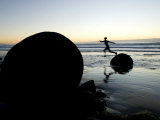 Woman Leaping from the Unique Round Moeraki Boulders at Sunrise