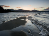 Sunset and Wave Action on the Volcanic Sand Shore of Lake Taupo