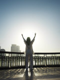 Buy Chinese Woman Practicing 'Tai Chi' Overlooking the Huang Pu River at AllPosters.com