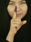 Young Girl Shows Her Inked Finger, Even Though She Was Too Young to Vote, in Karbala, Iraq