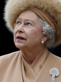 Britain's Queen Elizabeth II Looks Up at the Statue of Her Mother at the Unveiling Ceremony