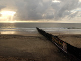 Man Jogs by the Beach Towards the Wall Dividing Mexico and the U.S. in Tijuana, Mexico