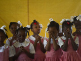 School Girls Pray before Class at the Sacred Heart of Turgeau School in Port-Au-Prince