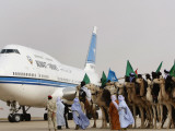 Libyan Camel Riders Holding Flags of Arab Countries Welcome Kuwaiti Airplane Carrying the Emir