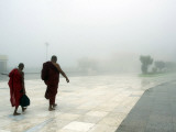 Buddhist Monks Walk Along a Road to Kyeik-Hti-Yoe Pagoda in Kyeikhto