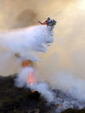 Buy Los Angeles City Fire Helicopter Drops Water on a Hot Spot in the Angeles National Forest at AllPosters.com